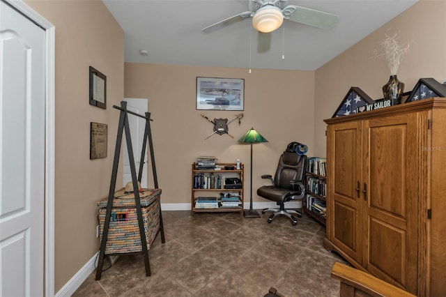 office area featuring ceiling fan and a barn door