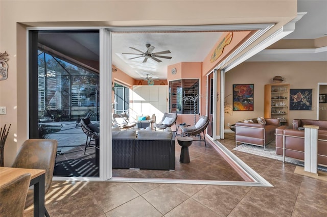 tiled living room with ceiling fan