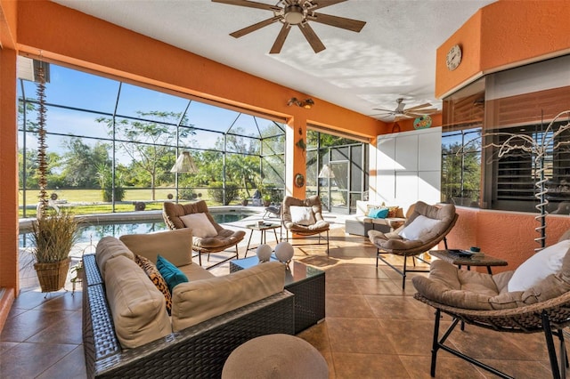 sunroom featuring ceiling fan