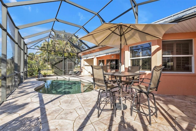 view of patio featuring a lanai