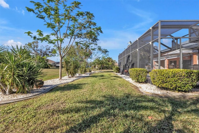 view of yard with a lanai