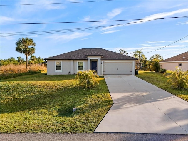 view of front of home featuring a front yard and a garage