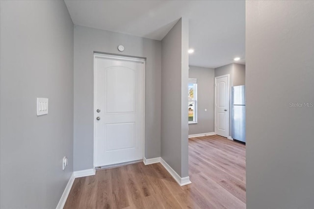 foyer with light wood-type flooring