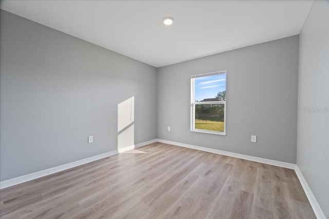 unfurnished room with light hardwood / wood-style floors