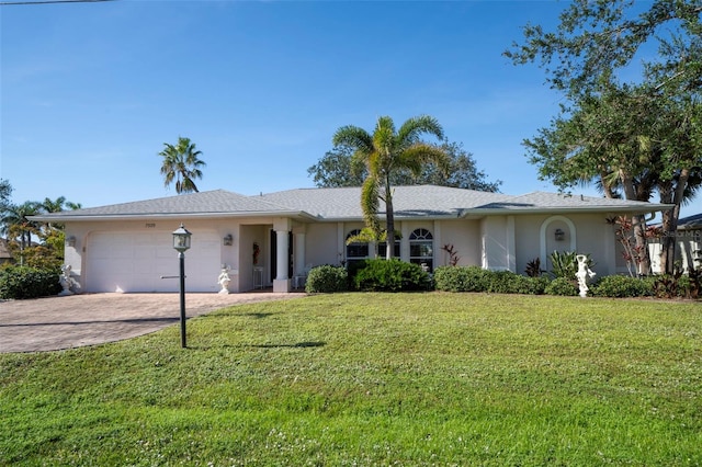 single story home with a garage and a front yard