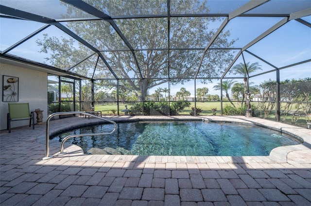 view of swimming pool featuring glass enclosure and a patio area