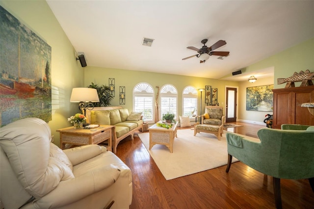 living room featuring dark hardwood / wood-style flooring and ceiling fan