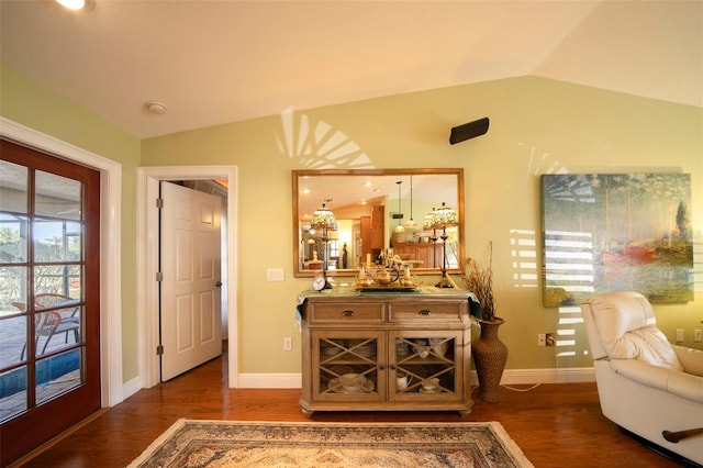 interior space with dark hardwood / wood-style floors and lofted ceiling