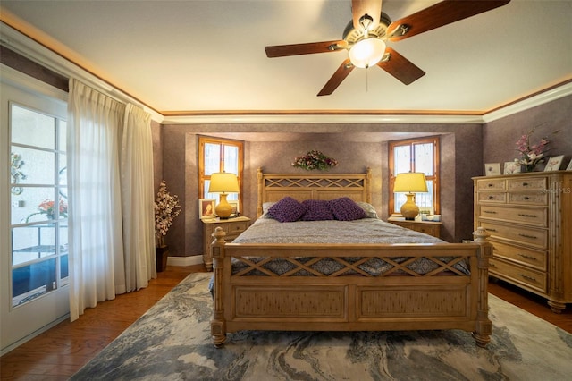 bedroom with ceiling fan, dark hardwood / wood-style flooring, and ornamental molding