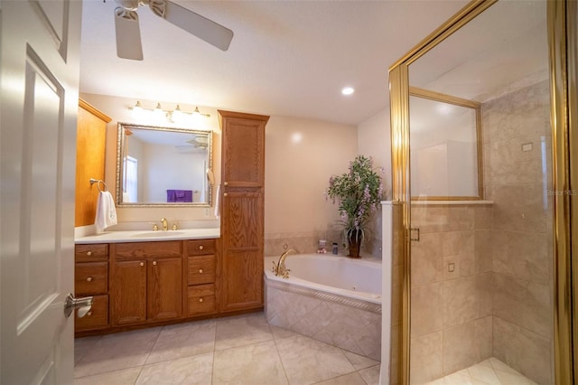 bathroom featuring tile patterned floors, ceiling fan, vanity, and independent shower and bath