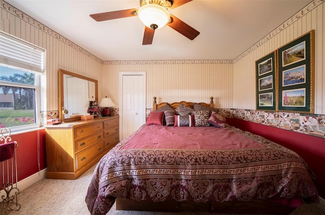 carpeted bedroom with ceiling fan