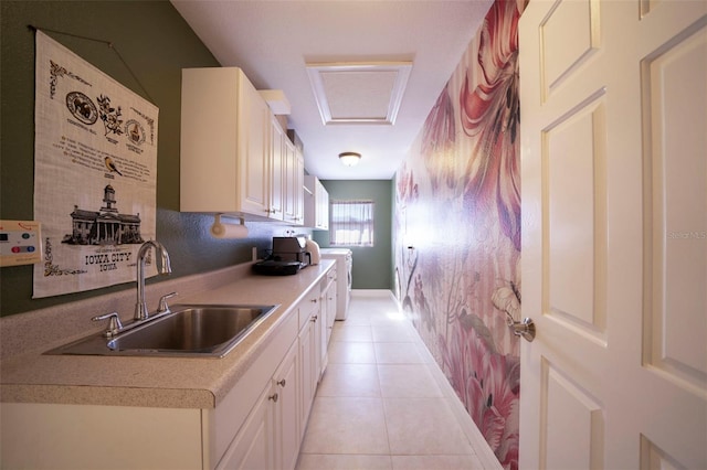 kitchen featuring light tile patterned flooring and sink