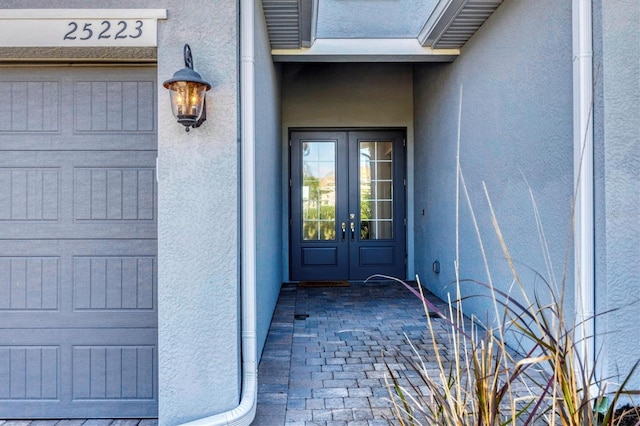 property entrance featuring french doors