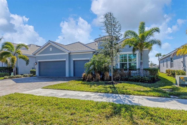 view of front of house featuring a garage and a front yard