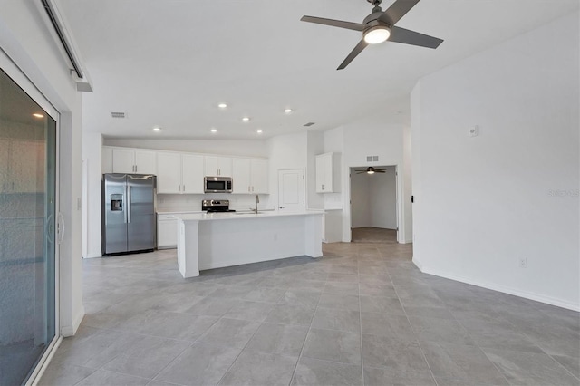 12470 Wellen Golf St Unit 203, Venice, FL 34293 - kitchen with sink, ceiling fan, stainless steel appliances, an island with sink, and white cabinets