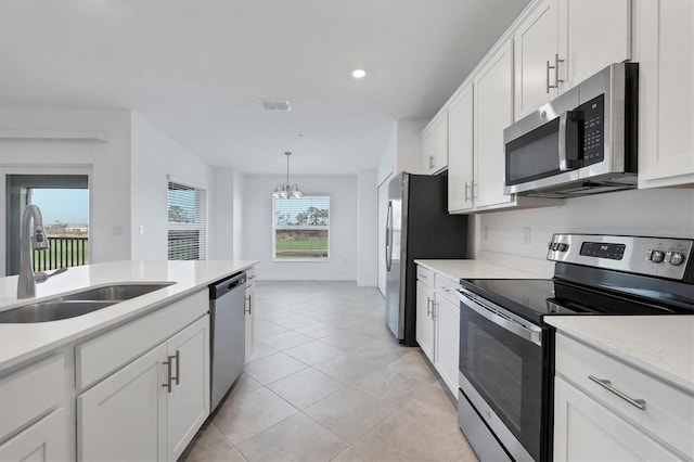 12470 Wellen Golf St Unit 203, Venice, FL 34293 - kitchen featuring white cabinetry, sink, and appliances with stainless steel finishes