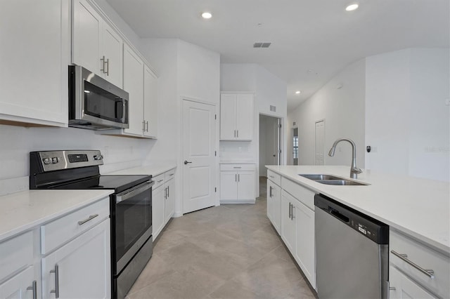 12470 Wellen Golf St Unit 203, Venice, FL 34293 - kitchen featuring white cabinetry, sink, stainless steel appliances, and light stone countertops