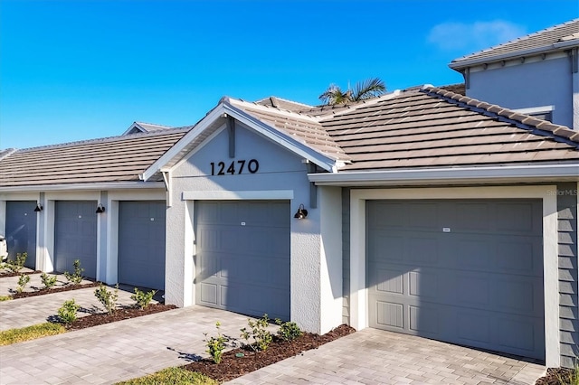 12470 Wellen Golf St Unit 203, Venice, FL 34293 - view of front facade featuring a garage