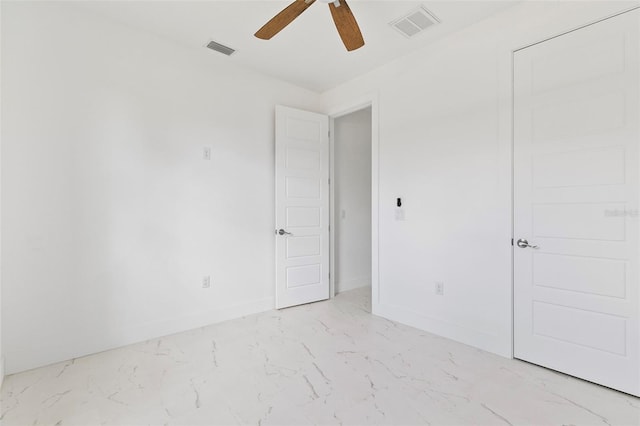 empty room featuring ceiling fan