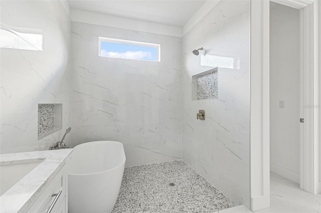 bathroom featuring vanity and separate shower and tub