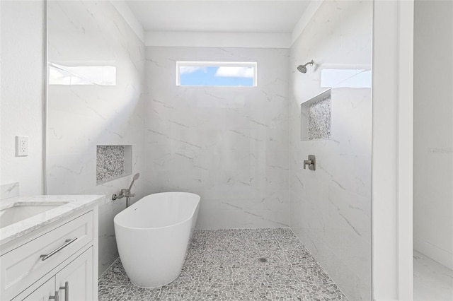 bathroom with vanity and independent shower and bath