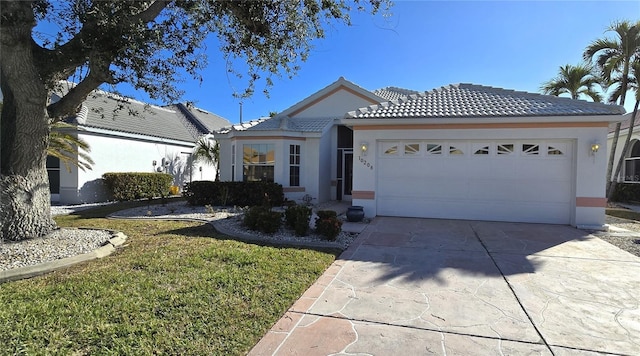 ranch-style house with a front lawn and a garage