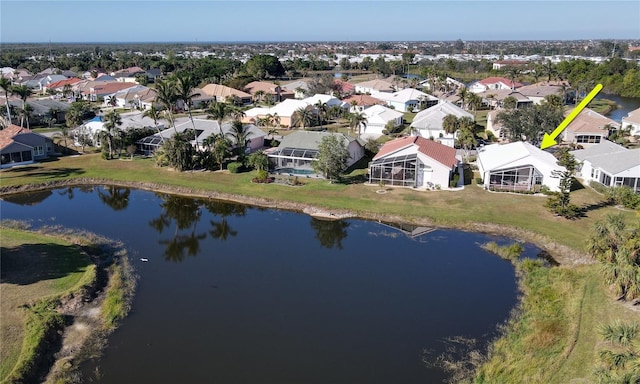 birds eye view of property featuring a water view