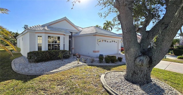 single story home featuring a garage and a front lawn