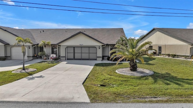 ranch-style house with a garage and a front lawn