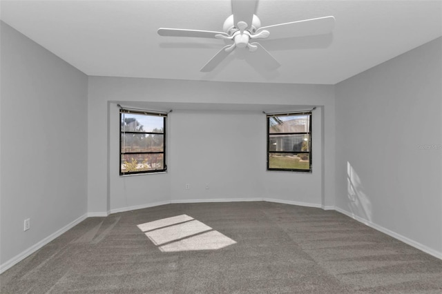 spare room featuring carpet flooring and ceiling fan