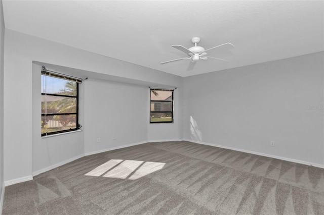 spare room with carpet and ceiling fan