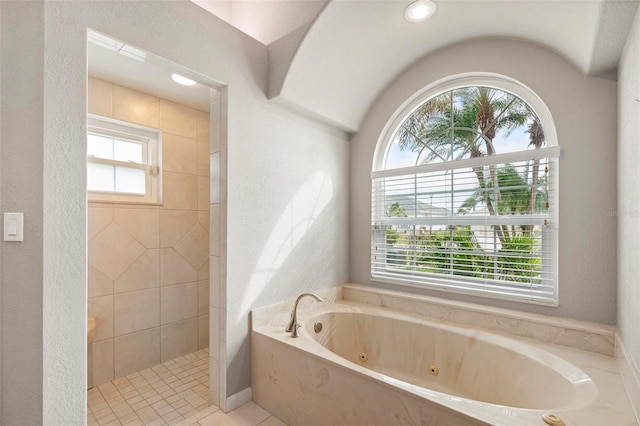 bathroom featuring plus walk in shower and tile patterned floors