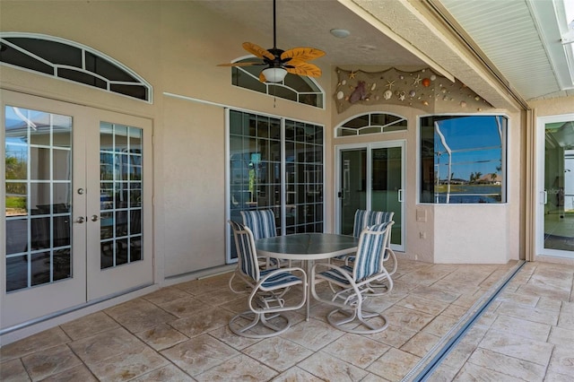 view of patio featuring ceiling fan and french doors