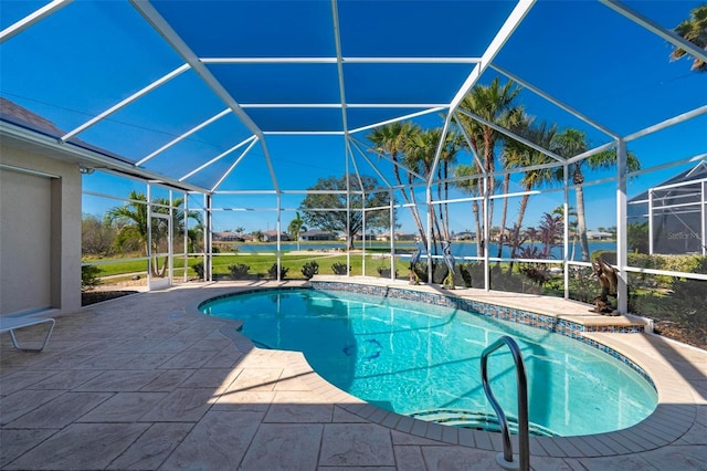 view of swimming pool featuring glass enclosure and a patio area