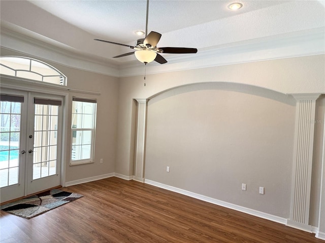 13028 SW Kingsway Cir, Lake Suzy, FL 34269 - entryway featuring french doors, dark wood-style floors, decorative columns, and ornamental molding