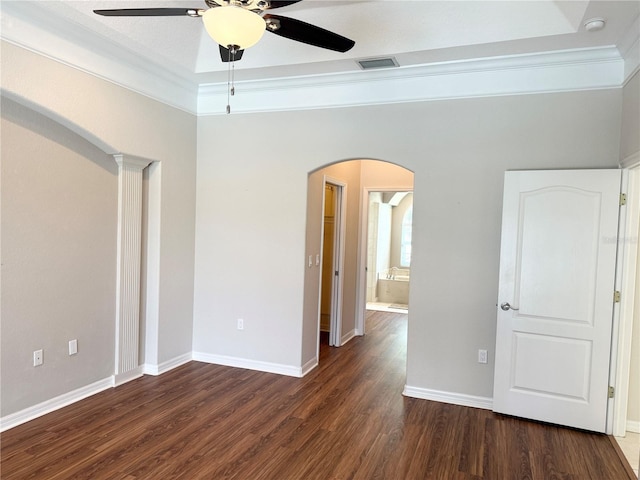 13028 SW Kingsway Cir, Lake Suzy, FL 34269 - spare room with ceiling fan, arched walkways, dark wood-style flooring, ornamental molding, and a smoke detector