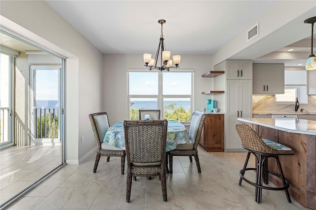 dining room featuring a chandelier