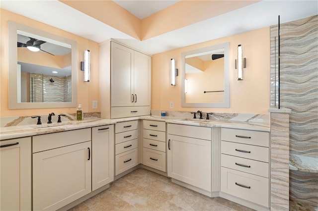 bathroom featuring a shower and vanity