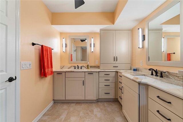 bathroom with ceiling fan and vanity