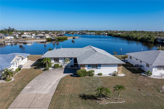 birds eye view of property featuring a water view