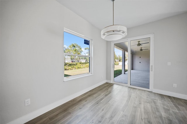 spare room featuring ceiling fan and wood-type flooring