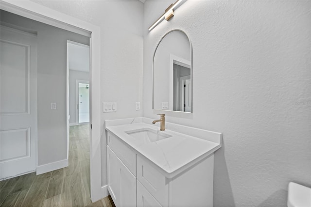 bathroom featuring vanity and hardwood / wood-style flooring