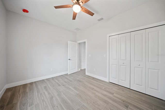 unfurnished bedroom featuring a closet, ceiling fan, and light hardwood / wood-style floors