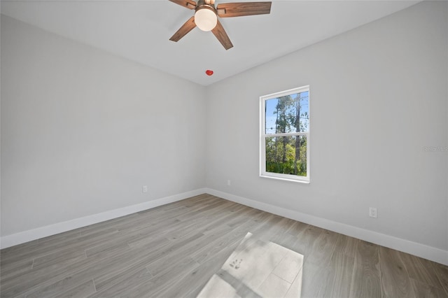 unfurnished room with ceiling fan and light hardwood / wood-style flooring