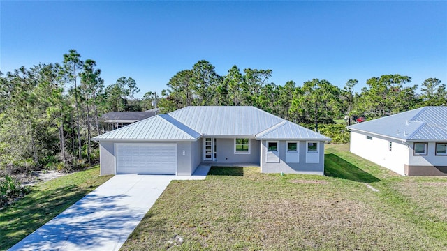 single story home featuring a front lawn and a garage