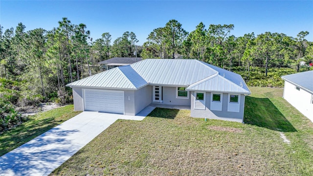 view of front of home featuring a garage and a front lawn