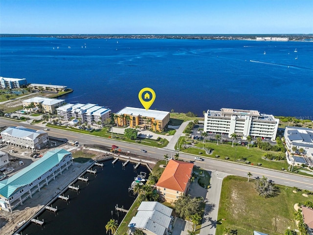 birds eye view of property featuring a water view