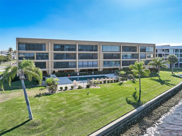 view of building exterior with a community pool