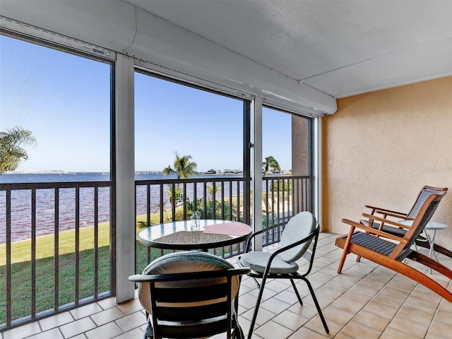 sunroom with a water view