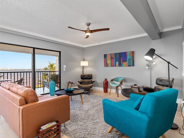 tiled living room featuring beam ceiling, ceiling fan, crown molding, and a textured ceiling